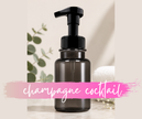 Champagne Cocktail foaming hand soap fruity citrus scent in a grey pump bottle